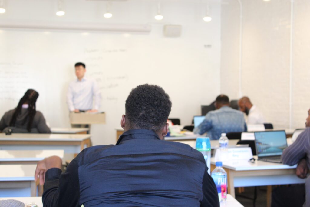 A Pivot Fellow pictured in a Negotiation Works class session