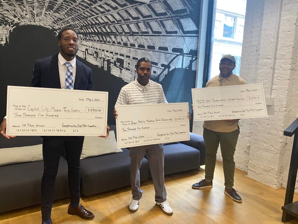 Pitch Competition winners Tariq Gaston (left), Damon Donalson-Bey (center), and Herbert Robinson (right) with their prize winnings.